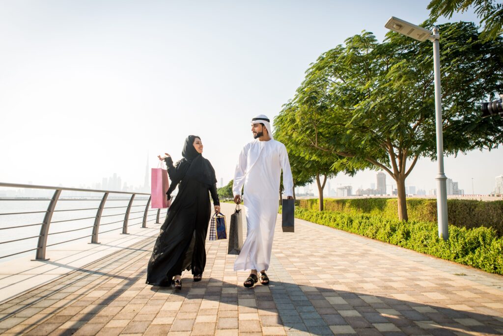 Beautiful middle eastern couple dating outdoors in Dubai - Married pair meeting outdoors and having fun